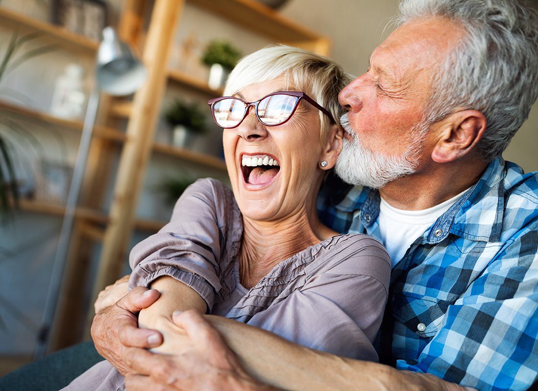 Medicare - Portrait of an Elderly Man Holding his Excited Wife's While They Spend Together at Home