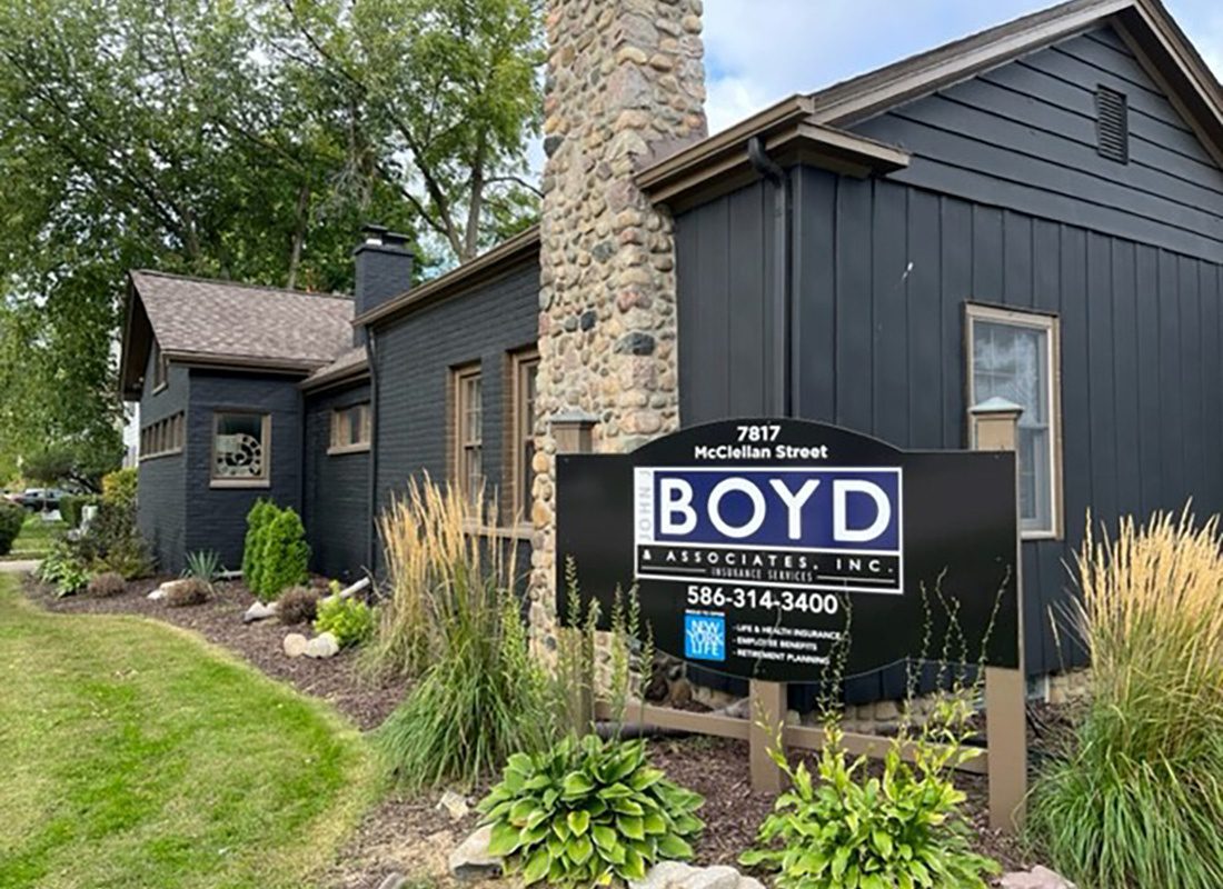 Utica, MI - Exterior View of John J. Boyd & Associates Office Building with a Sign Out Front in a Landscaped Mulch Bed in Utica Michigan